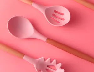 Pink silicone kitchen utensils with wooden handles, heat resistant daily cooking tool set.