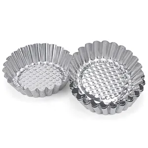 Stainless steel egg tart molds, durable baking tools with fluted edges and non-stick textured bottom.