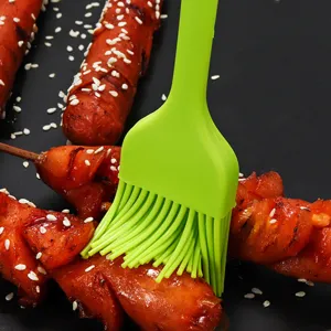 Silicone basting brush for barbecue, green baking oil brush and pastry tool with seamless design.