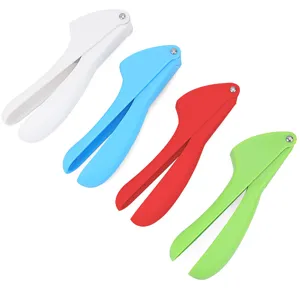 Detailed view of handheld manual plastic garlic press in vibrant colors for kitchen use.