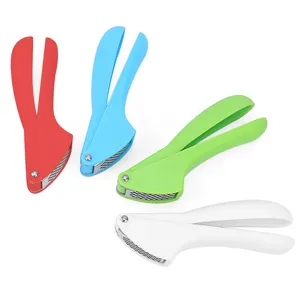 Close-up detail of multi-color manual garlic press kitchen tools with stainless steel.