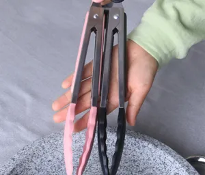 Silicone 9-inch food tongs detail, stainless steel kitchen tool for BBQ and baking use.