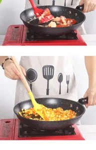 Silicone kitchen spatula detail showing flexible head and wooden handle stirring food in pan.