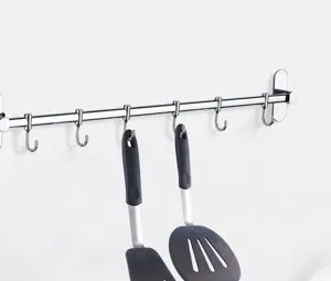 Stainless steel kitchen rail with silicone spatulas set for cooking and kitchen organization.
