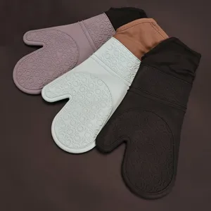 Heat resistant silicone oven mitts with non-slip rings and long cuffs for kitchen baking.