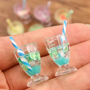 Miniature resin cocktail drink charm detail view, showing realistic lime slice and striped straw design.