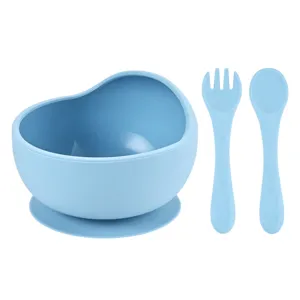 Silicone baby feeding bowl set with suction cup, fork and spoon in light blue color.