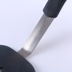 Silicone slotted spatula for non-stick pan, high temperature resistant kitchen cooking tool.