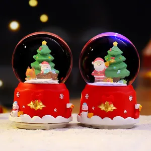 Kerst sneeuwbol muziekdoos met kerstman en boom, perfecte feestelijke decoratie en cadeau.