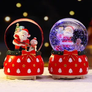 Weihnachts Schneekugel Spieluhr mit Weihnachtsmann und Schneemann, rote Schleife Deko.