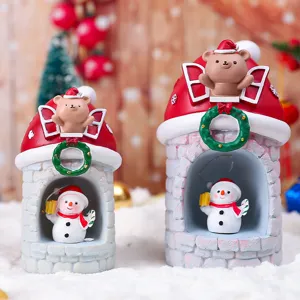 Detailansicht der weihnachtlichen Harz-Nachtlichter mit süßen Bären und Schneemännern.