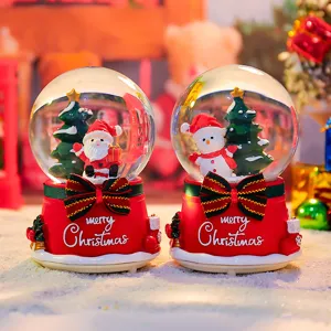 Christmas snow globe music box with Santa and snowman, glowing light and floating snow design.
