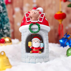 Detailaufnahme der Weihnachts-Harz-Nachtlicht-Dekoration mit Weihnachtsmann und Bär.