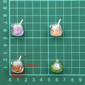 Detailed view of miniature resin coffee cup charms showing size dimensions and front design.