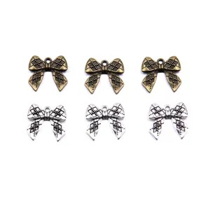 Vintage bowknot metal charms in 2 colors 19x21mm, perfect for DIY jewelry and pendants.