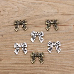 Detail view of 19x21mm retro bow charms in two vintage colors, perfect for DIY jewelry making.