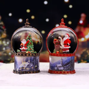 Lanterne boule à neige de Noël veilleuse décorative avec Père Noël en résine et village.