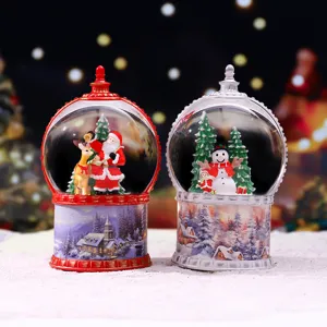 Boule à neige de Noël veilleuse avec base en résine pour décoration de fête.