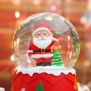 Christmas snow globe detail view, cute glowing Santa decor for holiday room ornament and gifts.
