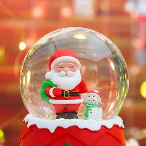 Christmas snow globe with cute Santa Claus figurine, glowing ambient LED night light gift.