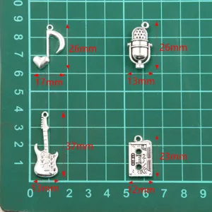 Music charm metal pendant alloy jewelry accessories set for DIY crafting and necklaces.