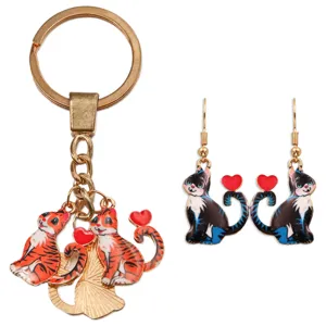 Enamel cat keychain and matching earrings set featuring cute heart tails in gold finish.