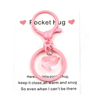 Pink metal lobster clasp keychain with cute duck pendant and pocket hug card gift.
