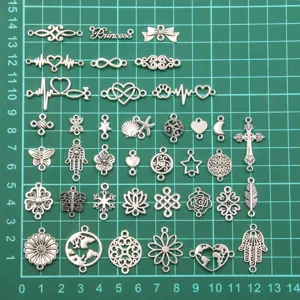 Silver alloy charms set, assorted hollow plant animal connectors for DIY jewelry making.