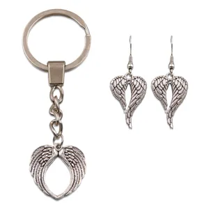 Detailed close-up view of silver alloy heart angel wings keychain and matching earrings.