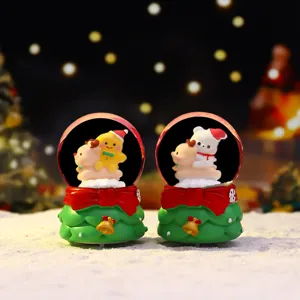 Mini glowing Christmas snow globe with cute deer and bear figures, festive home decor detail.