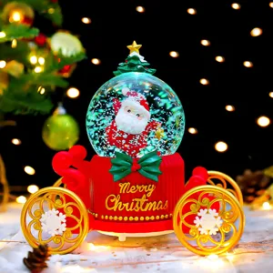 Detailed view of the Christmas snow globe carriage with brilliant lights and cute Santa figure.