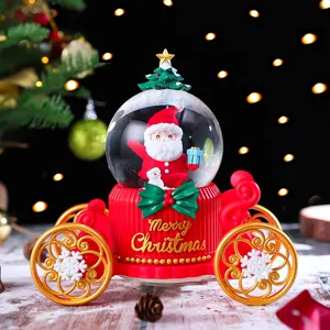 Christmas Santa carriage snow globe detail view, illuminated glowing tabletop decoration gift.
