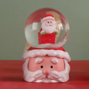 Weihnachten Weihnachtsmann Schneekugel mit Kamin Figur und festlicher Tischdeko Geschenk.
