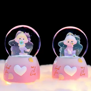 Unterwasserwelt Schneekugel Spieluhr mit süßem rosa Design, ideal als Geschenk für die Freundin.