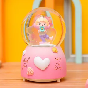 Unterwasserwelt Schneekugel Musikbox mit rosa Sockel und Muscheldekor, schönes Geschenk.