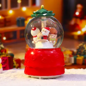 Weihnachtliche Schneekugel Spieldose mit Weihnachtsmann Figur und Beleuchtung Detail