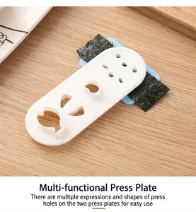 Close-up detail of a white plastic nori puncher mold with cute facial expression cutters.