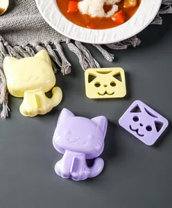 Cat rice ball mold detail view, showing cute kitty shapes and pressing plates for DIY meals.