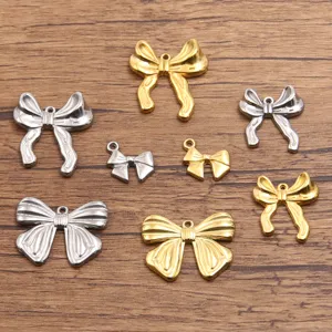 Stainless steel bowknot pendants in gold and silver, ideal for DIY handmade jewelry crafts.