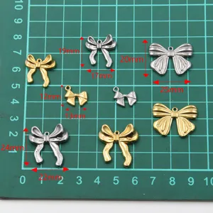 Stainless steel bow charms in gold and silver, perfect for DIY jewelry making and earrings.