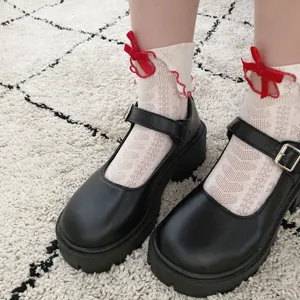 Detailed product view of cute Japanese JK style frilled lace bow short socks pair.