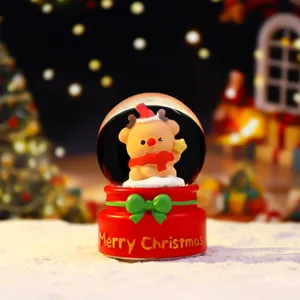 Christmas snow globe with cute bear figurine, glowing holiday decoration and festive gift.