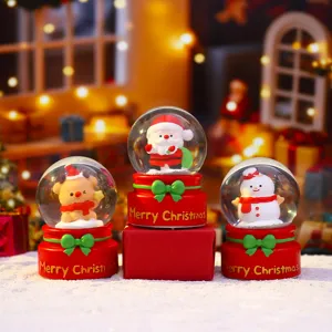 Christmas snow globe ornament with cute Santa snowman and reindeer designs for holiday decoration.