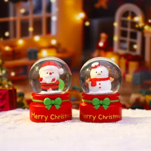 Cute Christmas snow globe with Santa and snowman, festive luminous tabletop decor gift.