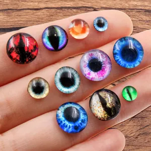 Glass cabochon doll eyes detail view showing various colorful animal eye designs for DIY crafts.