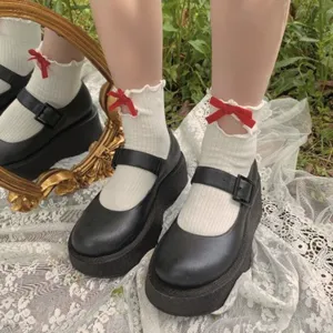 Japanese cute white mid tube socks with red bow lettuce edge and black platform shoes main view
