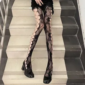 Detail view of women black fishnet tights featuring retro rose hollow mesh pattern for sexy style.