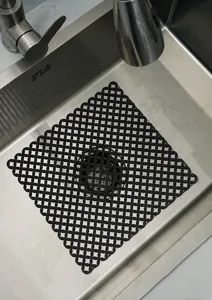 Tapis d'évier de cuisine en silicone protection de drainage noir design creux pour vaisselle.
