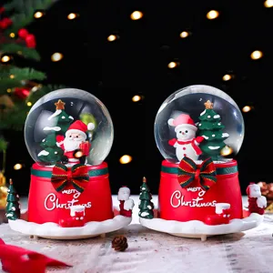 Christmas snow globe music box with glowing lights, featuring Santa and snowman designs.