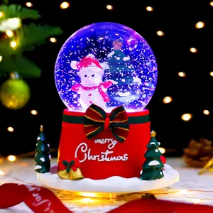 Christmas snow globe music box with glowing snowman and festive red base for home decor